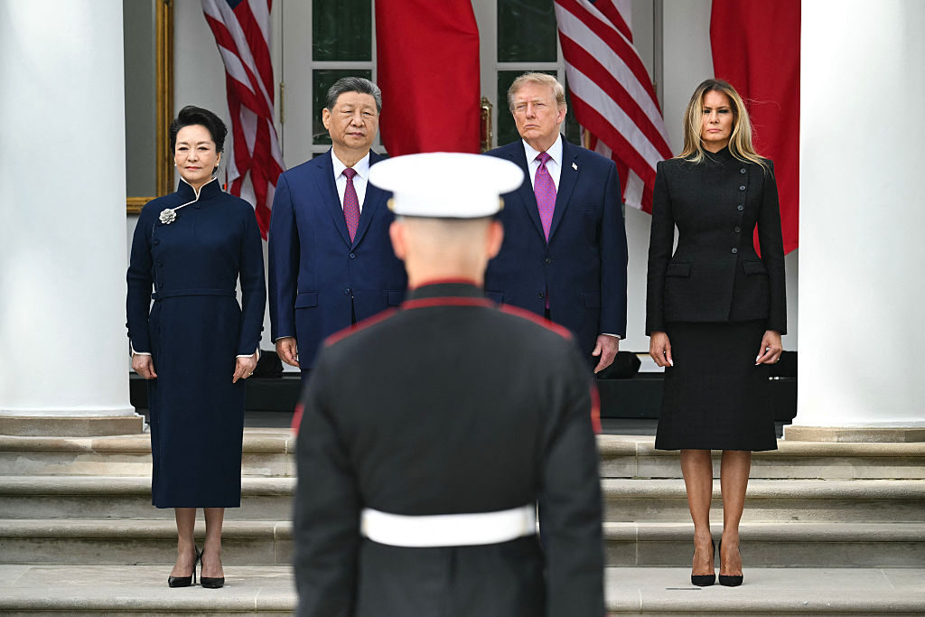 Amid surreal scenes, Trump flashes force and ‘friendship’ with China’s Xi